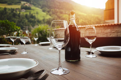 Wineglasses on table outdoors