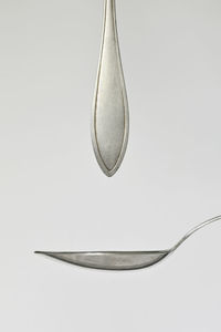 Close-up of water drop against white background