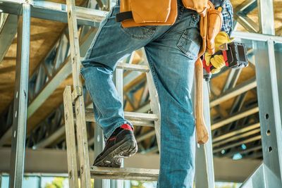 Low section of man working at construction site