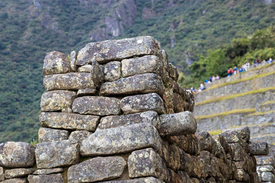 Stone wall against rocks