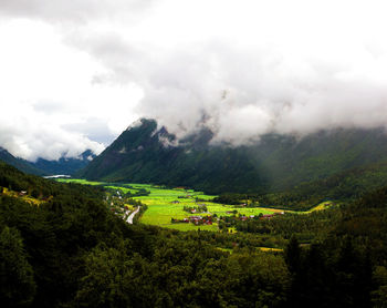 Scenic view of landscape against cloudy sky