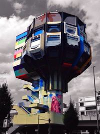 Low angle view of building against cloudy sky