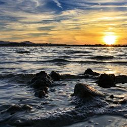 Scenic view of sea at sunset