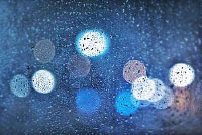 Full frame shot of raindrops on glass