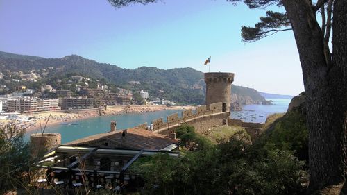 View of sea with buildings in background