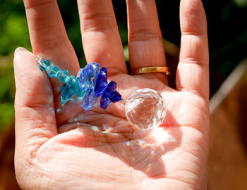 Close-up of hand holding hands