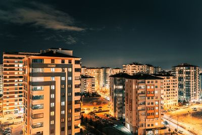 High angle view of illuminated buildings against sky