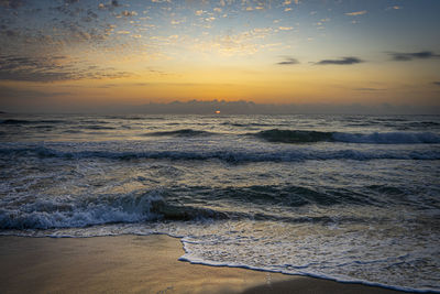 Scenic view of sea against sky during sunset