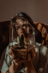 Portrait of woman looking at camera