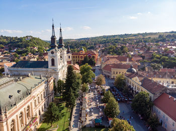 High angle view of buildings in town against sky