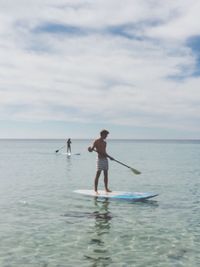Scenic view of sea against cloudy sky