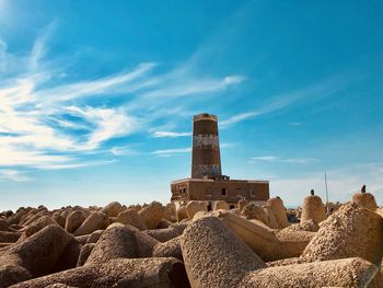 Castle on rock against sky