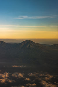 Scenic view of mountains against sky during sunset