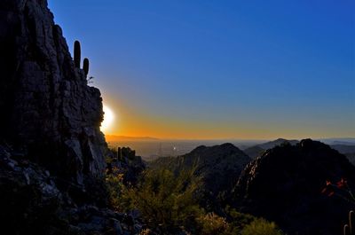 Scenic view of mountains against sky during sunset