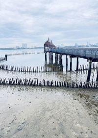 Pier over sea against sky