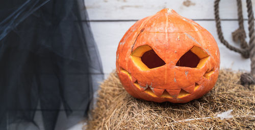 Close-up of pumpkin on stone during halloween