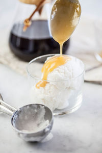 Close-up of ice cream in glass on table