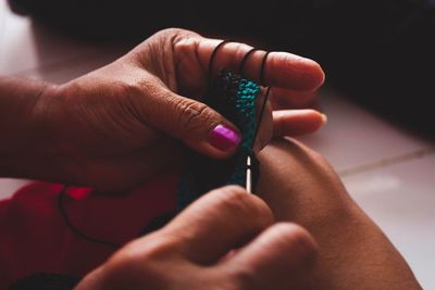 Close-up of human hand crocheting