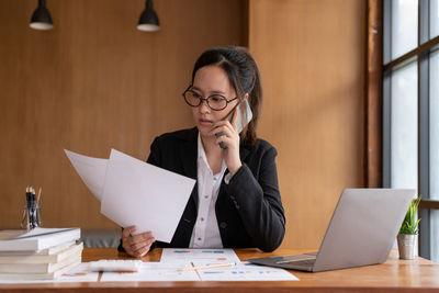 Businesswoman working at desk in office