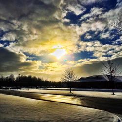 Scenic view of landscape against cloudy sky