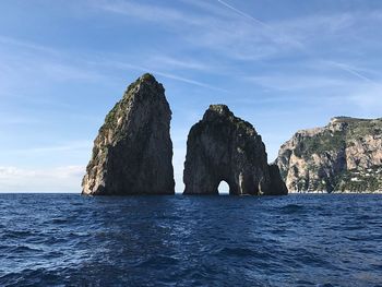 Scenic view of sea against blue sky