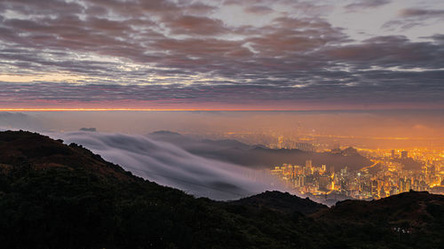 Sea of clouds over hong kong city at dawn, scenic view of dramatic sky at mountain top, tai mo shan