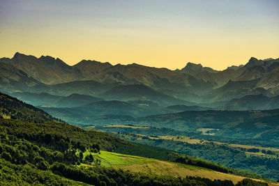 Scenic view of mountains against sky during sunset