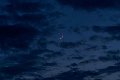 Low angle view of moon against sky at night