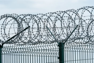 Security fence with a barbed wire. fence with a barbed wire.