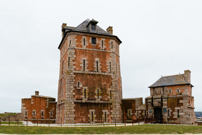 Low angle view of old building against sky