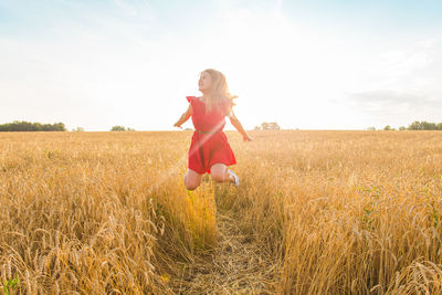 Full length of woman on field against sky