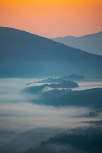 Scenic view of mountains against sky during sunset