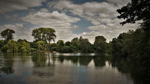 Scenic view of lake against cloudy sky