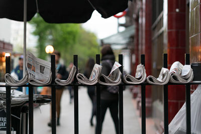 Close-up of metal railing in city