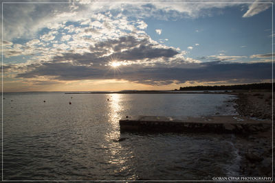 Scenic view of sea at sunset