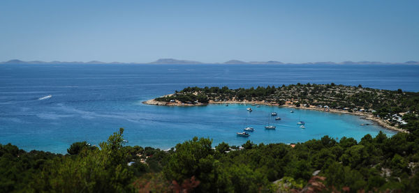 Scenic view of sea against clear blue sky