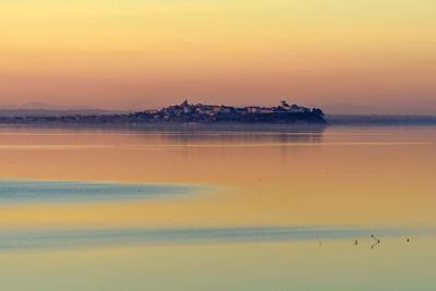 Scenic view of sea against sky at sunset