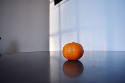 Close-up of orange fruit on table