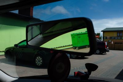 Close-up of car on road against sky