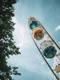 Low angle view of ferris wheel against sky