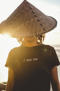 Rear view of man wearing sunglasses against sky