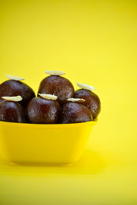 Close-up of yellow candies in bowl