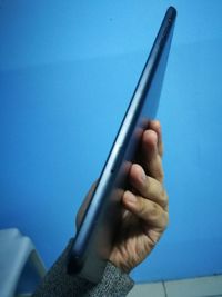 Close-up of hand holding mobile phone