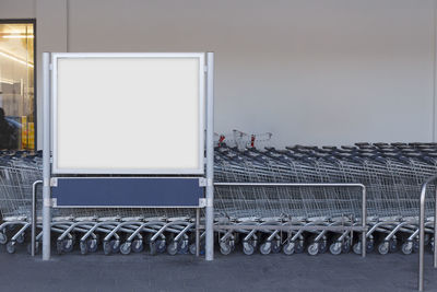 Empty chairs against sky