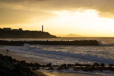 Scenic view of sea against sky during sunset