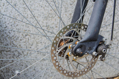 Close-up of bicycle on footpath