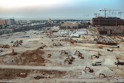 High angle view of cityscape against sky construction site
