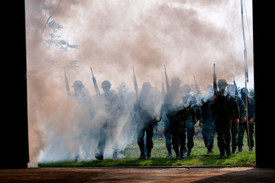 Panoramic view of people against sky