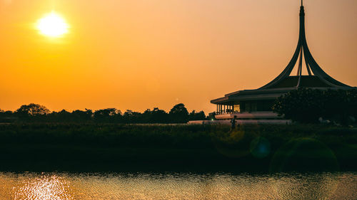 Silhouette of building during sunset