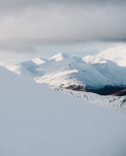 Scenic view of snow covered mountains